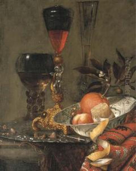 A Wanli Kraak Porselein Bowl, A 
Peeled Lemon, An Orange Withblossom, A Peach, Wild Strawberries, Two 
Facon-de-venises, And Aroemer Of White Wine Standing On An Auricular 
Chased Silverplatter, All On A Partially Draped Stone Ledge by Willem Kalf