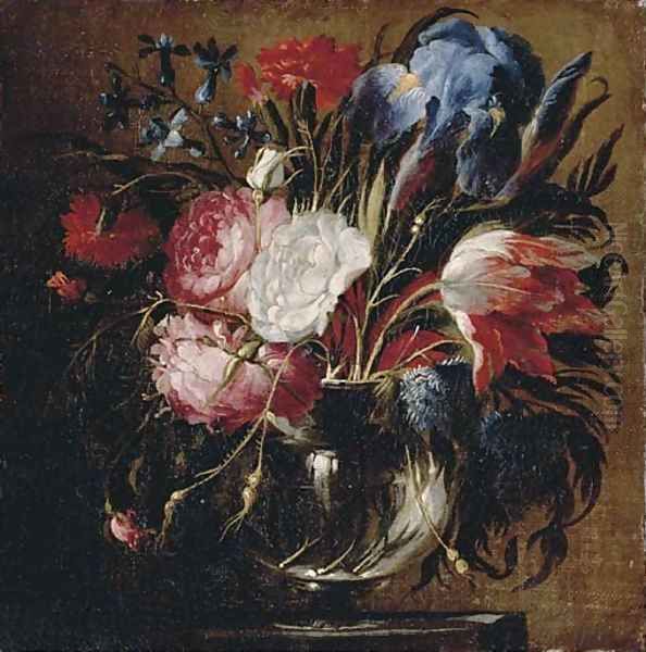 A tulip, carnations, roses, irises, bluebells and other flowers in a glass vase on a ledge Oil Painting by Juan De Arellano