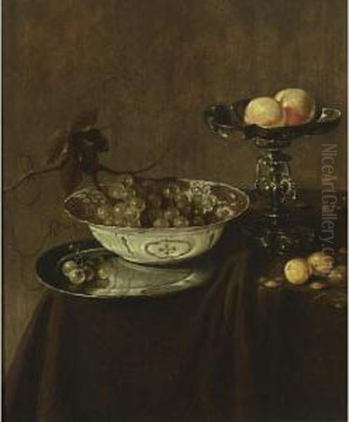 A Still Life With A Wan-li Porcelain Bowl With Grapes On A Pewter Plate, A Silver Tazza With Peaches, Together With Plums And Nuts, All On A Draped Table Oil Painting by Jan Jansz. Treck