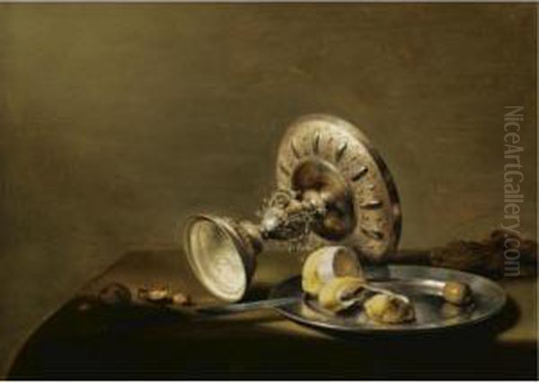 A Still Life With An Overturned 
Silver Tazza, A Silver Plate With A Partly Peeled Lemon And An Olive, 
With Walnuts And Hazelnuts On A Table Draped With A Green Cloth Oil Painting by Pieter Claesz.