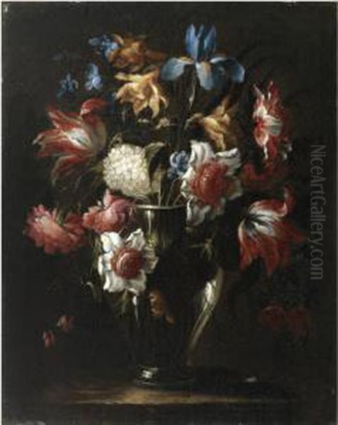 Still Life With Flowers In A 
Glass Vase, Including Blue Irises Andparrot Tulips, Arranged On A Stone 
Ledge Oil Painting by Juan De Arellano