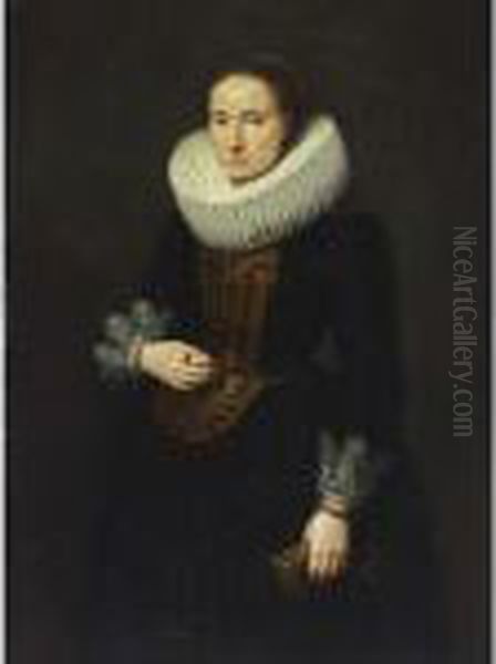 A Portrait Of A Lady, Standing 
Three-quarter Length, Wearing A Black Dress With White Lace Cuffs And 
Collar And An Embroidered Bodice, Holding Gloves In Her Left Hand Oil Painting by Cornelis De Vos