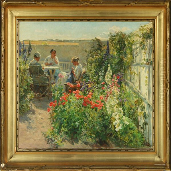 Three Women Seated At A Table In A Flowering Garden Oil Painting by Knud Larsen