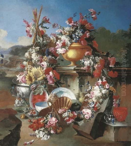 Roses, Narcissi, Carnations, 
Tulips And Other Flowers In An Urn With Flower Garlands Draped On A 
Stone Pedestal And Surrounded By Flowers And Fruit In A Landscape Oil Painting by Giuseppe Lavagna