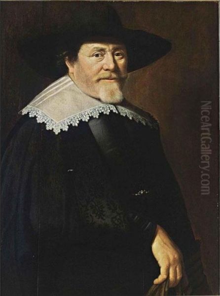 A Portrait Of A Bearded 
Gentleman, Half Length, Wearing A Black Suit, A Black Hat And A White 
Lace Collar, Holding Gloves In His Right Hand Oil Painting by Claes Cornelisz Moeyaert