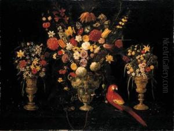 Tulips, Carnations, Irises, 
Daffodils, Hyacinths And Other Flowersin Three Ornamental Silver-gilt 
Standing Cups With A Parrot And Achained Squirrel Oil Painting by Astolfo Petrazzi