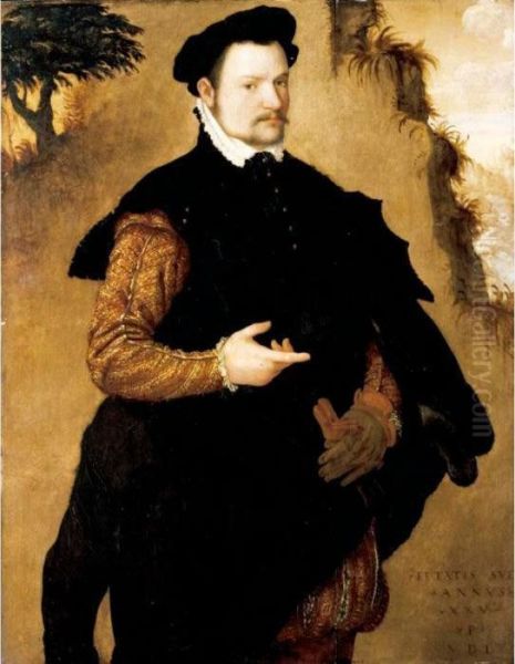 Portrait Of A Gentleman, 
Three-quarter Length, Wearing An Elaborately Embroidered Doublet And A 
Fur-trimmed Black Cape Oil Painting by Lambert Sustris