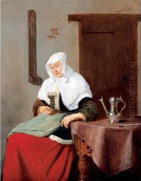 A Woman Seated At An Inn Table Holding A Roemer Oil Painting by Quiringh Gerritsz. van Brekelenkam