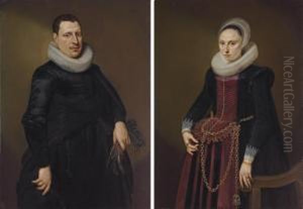 Portrait Of A Gentleman, 
Three-quarter Length, In A Black Coat With White Collar, Holding A Pair 
Of Gloves; And Portrait Of A Lady, Three-quarter Length, In A Black And 
Red Dress With Gold Chains, By A Chair Oil Painting by Cornelis van der Voort