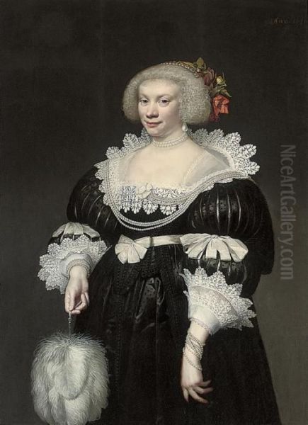 Portrait Of A Lady, 
Three-quarter Length, In A Black Slashed Silkdress With Lace Collar And 
Cuffs, A Fan In Her Right Hand Oil Painting by Jan Anthonisz Van Ravesteyn