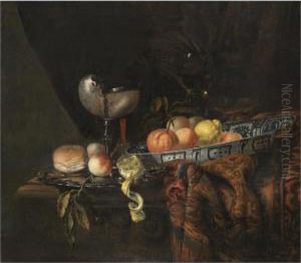 A Still Life With Oranges, 
Peaches And A Lemon In A Blue-and-white China Bowl, A Silver-gilt 
Nautilus Cup On A Silver Gilt Plate Together With A Lemon, A Bread Roll 
And A Knife, Together With A Roemer And A Wine Glass, All On A 
Partly-draped Table Oil Painting by Juriaen van Streeck