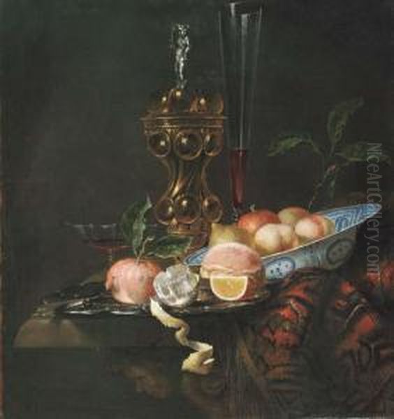 Peaches And A Lemon In A Wanli 
'kraak' Porselein Bowl, A Partlypeeled Lemon, An Orange Slice, A 
Pomegranate And Bread On A Pewterplate, A Gilt Cup And Cover And A Wine 
Flute On A Partly Drapedtable Oil Painting by Juriaen van Streeck