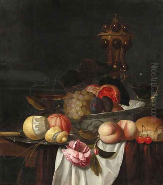 Grapes, pomegranates and plums in a Wanli 'kraak' porselein bowl, an orange and a partly peeled lemon on a pewter plate, peaches, cherries, bread Oil Painting by Jacob van Hulsdonck