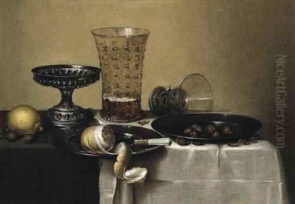 A peeled lemon, a knife and hazel-nuts on pewter plates Oil Painting by Willem Claesz. Heda