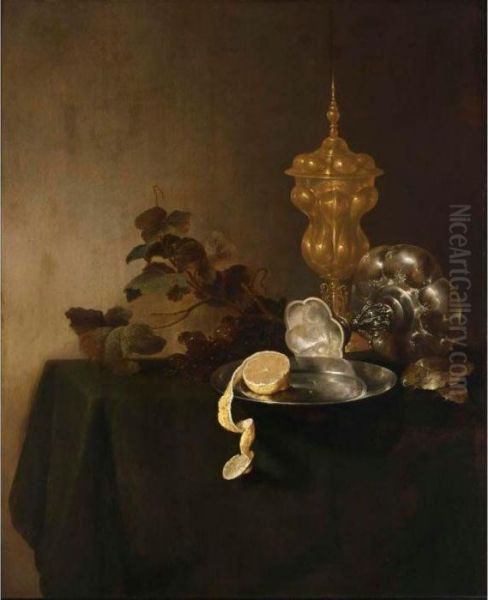 A Still Life Of A Tazza, A 
Peeled Lemon On A Pewter Plate, A Silver-gilt Cup With Cover And Grapes,
 All On A Table Draped With A Green Cloth Oil Painting by Jan Davidsz De Heem