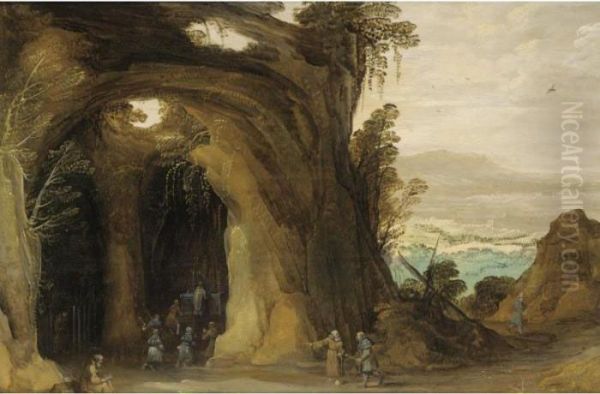 A Landscape With Pilgrims 
Attending A Service In A Grotto, A Monk Reading In The Foreground Oil Painting by Joos De Momper