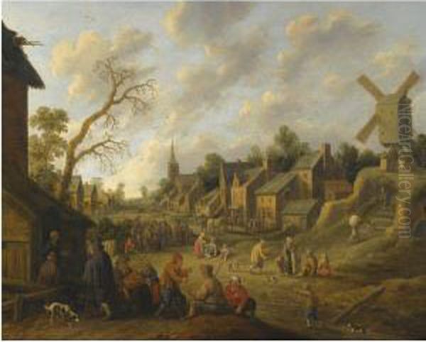 A Wide Street Through A Village Filled With Numerous Figures Andoverlooked By A Windmill Oil Painting by Joost Cornelisz. Droochsloot