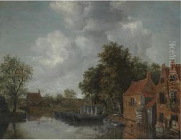 A View On A Canal In A Dutch Village With Barges Moared On The Quay Near Houses Oil Painting by Meindert Hobbema