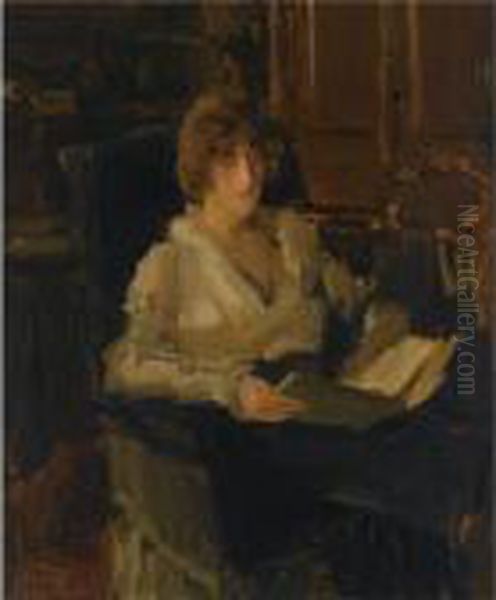 A Woman In A Chair Reading Oil Painting by Isaac Israels