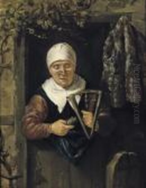 An Old Woman Standing In A Doorway Spinning Oil Painting by Nicolaes Maes