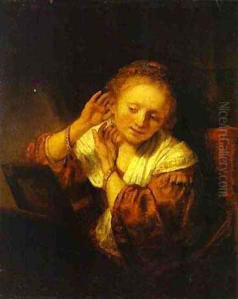 A Young Woman Trying On Earings 1657 Oil Painting by Harmenszoon van Rijn Rembrandt