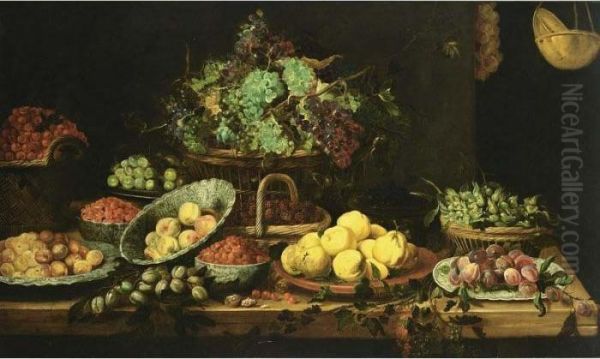 An Extensive Still Life Of 
Peaches, Apricots And Strawberries In Wan-li Porcelain Bowls, 
Quince-pears On A Stone Plate, Black Prunes On A Chinese Plate, 
Hazelnuts, Grapes, Blackberries And Cherries In Baskets, Berries And 
White Prunes In Copper Bo Oil Painting by Frans Snyders