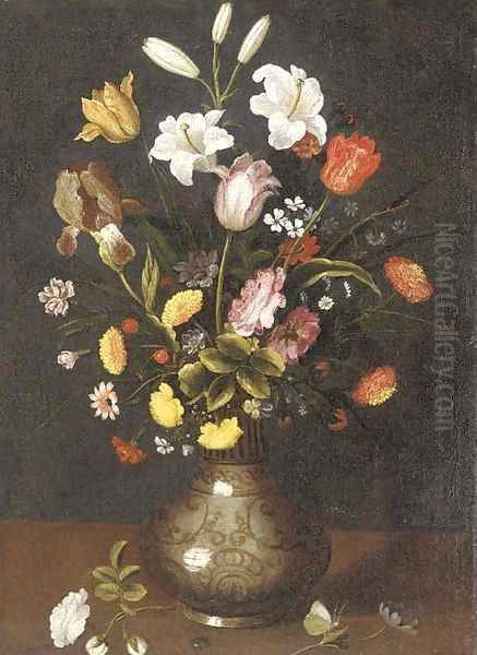 Lilies, tulips, an iris and other flowers in a porcelain vase on a ledge Oil Painting by Spanish School