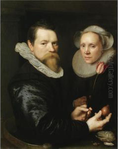 A Double Portrait Of A Husband 
And Wife, Both Half-length, He Holding A Tulip And A Bulb, A Selection 
Of Shells On The Shelf Below Oil Painting by Michiel Jansz. Van Miereveldt