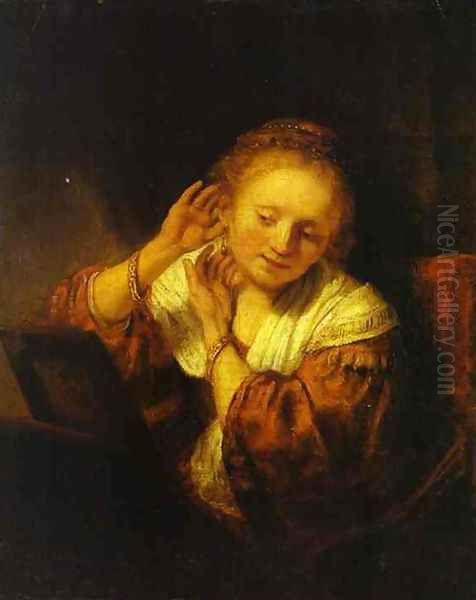 A Young Woman Trying on Earings Oil Painting by Rembrandt Van Rijn