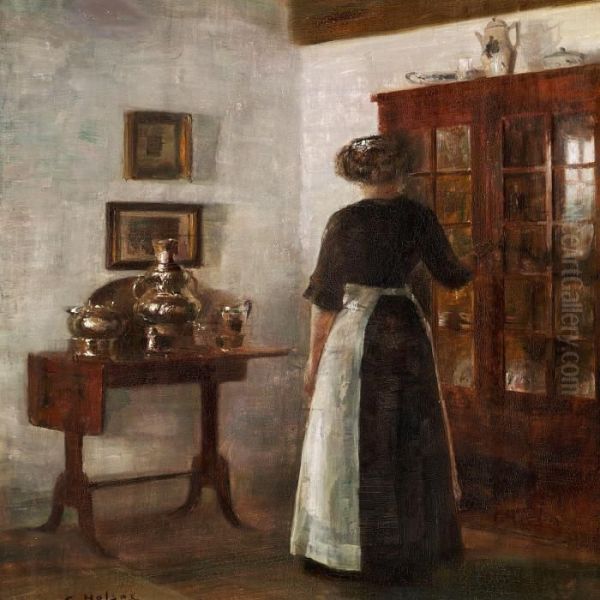 Interior With A Woman Standing Next To A Cabinet Oil Painting by Carl Vilhelm Holsoe