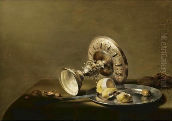 A Still Life With An Overturned Silver Tazza, A Silver Plate With A Partly Peeled Lemon And An Olive, With Walnuts And Hazelnuts Oil Painting by Pieter Claesz.