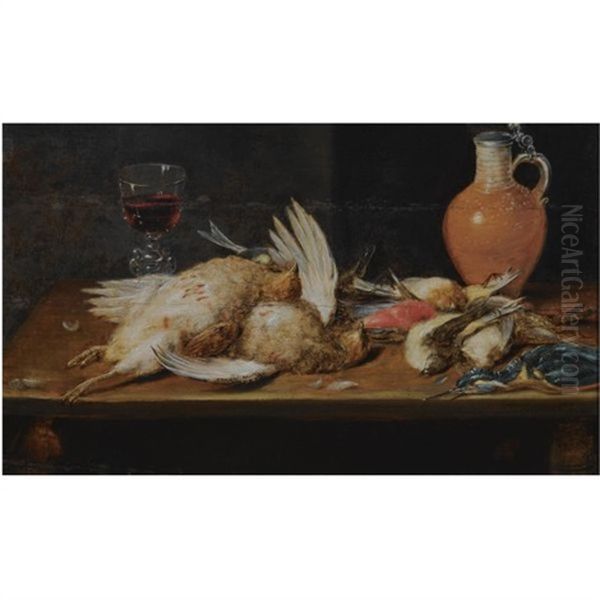 A Still Life With A Robin, A Kingfisher, Partridges And Songbirds, All On A Wooden Table, Together With A Glass And An Earthenware Jug Oil Painting by Alexander Adriaenssen the Elder