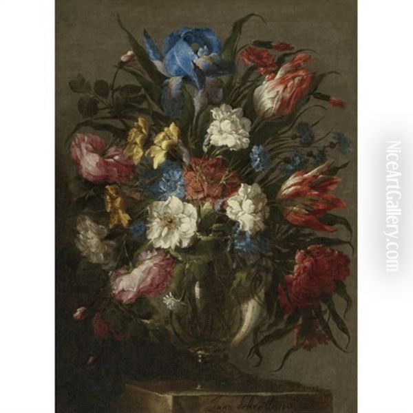 Still Life Of Tulips, Roses, Peonies, Iris And Other Flowers In A Glass Vase, Resting On A Table Oil Painting by Juan De Arellano