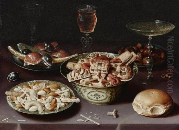 A Still Life Of Porcelain Vessels Containing Sweets, Pewter Plates Bearing Sweets And Chestnuts, Three Pieces Of Glassware And A Bread Roll On A Table Draped With A Mauve Cloth Oil Painting by Osias Beert the Elder