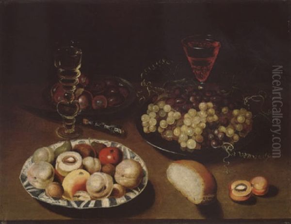 Still Life Of Peaches, Figs, Apples And Walnuts In A Blue And White Porcelain Bowl by Osias Beert the Elder