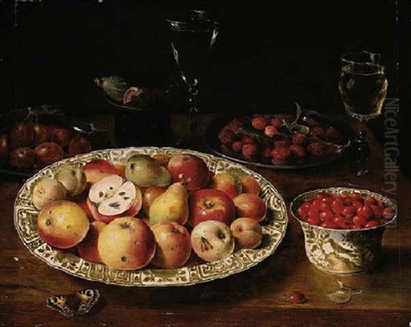 A Still Life Of Apples, Peaches And Pears In A Wan-li Porcelain Dish, Red Grapes, Plums, Raspberries, Figs, Glasses And A Butterfly On A Wooden Table Top by Osias Beert the Elder