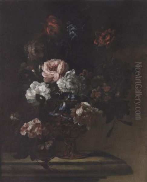 Narcissi, Delphiniums, Tulips, Morning Glory And Other Flowers In An Urn Upon A Stone Ledge by Pieter Casteels III