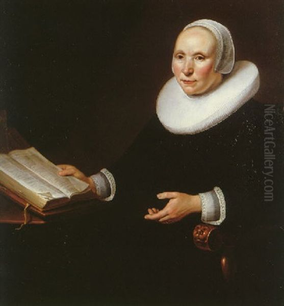 Portrait Of A Lady Wearing A Black Dress With A White Ruff, Cuffs And Cap Seated In A Chair, Turning The Pages Of A Book Which Is Resting On A Table Oil Painting by Jacob Gerritsz Cuyp