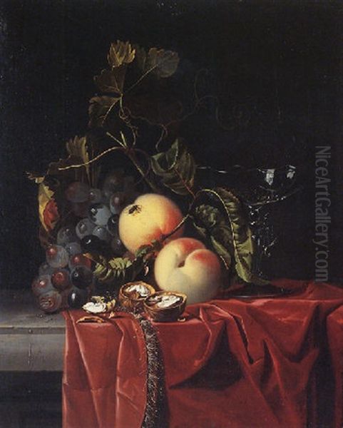 A Still Life Of Grapes, Peaches, Walnuts And A Wine Glass Upon A Ledge Draped With A Red Cloth Oil Painting by Isaac Denies