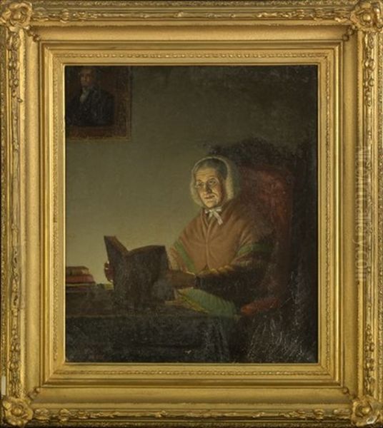 Elderly Woman Seated At A Desk Reading A Book By Candlelight Oil Painting by James L. Dick