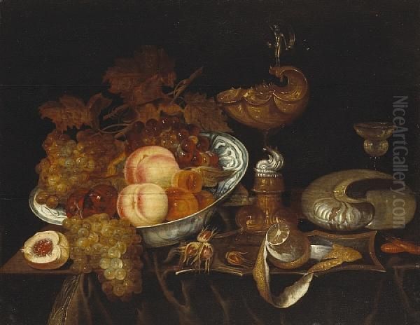 A Still Life Of Fruit In A Blue And Whitebowl, A Ewer, A Goblet, A Partially-peeled Lemon And A Nautilusshell, All Resting On A Partially Draped Table Oil Painting by Bartholomeus Assteyn