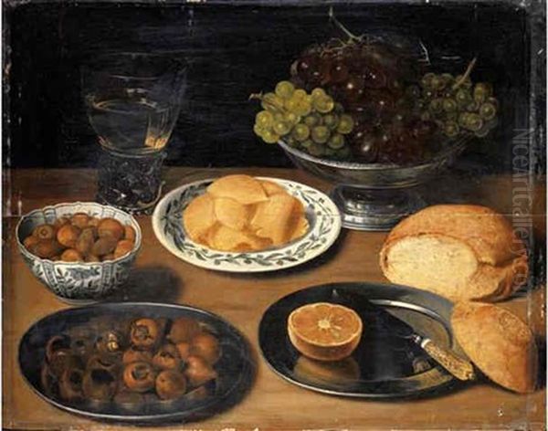 Grapes In A Pewter Bowl, A Roemer Of White Wine, Hazelnuts And Slices Of Butter In Porcelain Dishes, Chestnuts, A Sliced Lemon And A Knife On Pewter Platters, With A Bread Roll On A Wooden Ledge Oil Painting by Georg Flegel