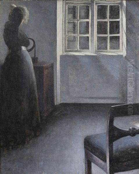 Woman Before A Mirror, Strandgade 30 Oil Painting by Vilhelm Hammershoi