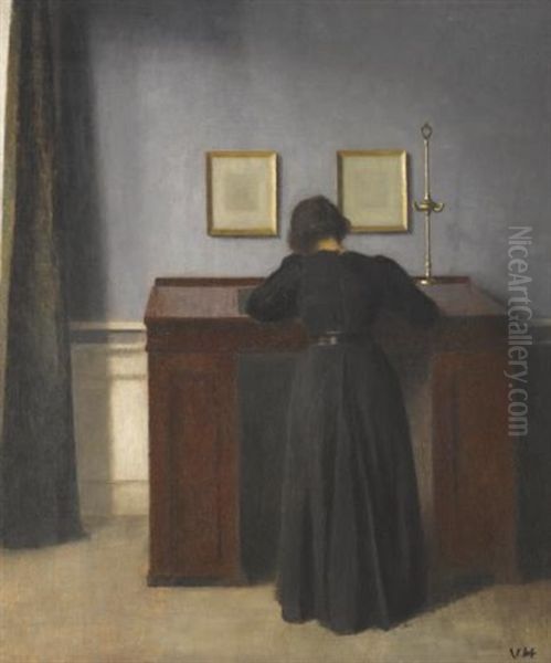 Ida Standing At A Desk Oil Painting by Vilhelm Hammershoi