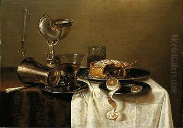 An Overturned Silver Tumbler And A Roemer On A Pewter Plate, A Facon-de-venise Wineglass, A Nautilus Cup, A Pie And A Lemon On Pewter Plates On A Table Oil Painting by Gerrit Willemsz. Heda