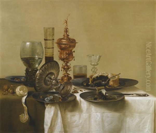 A Still Life With A Gilt Cup, A Silver Tazza, Glasses And Pewter Plates With A Pie, Peeled Lemon And Nuts, All Upon A Draped Table Oil Painting by Willem Claesz Heda