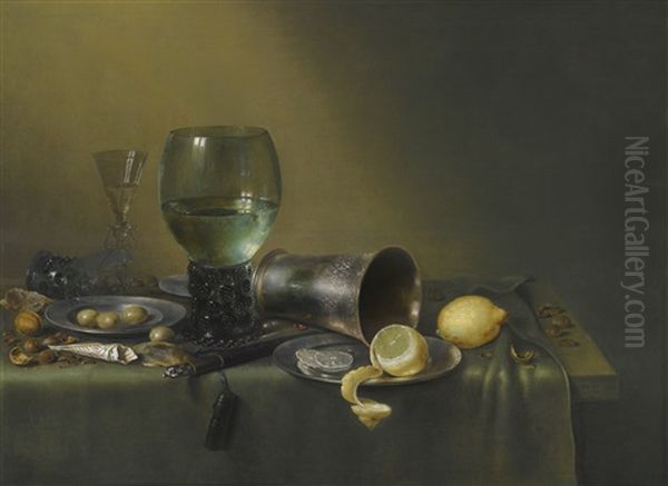 A Still Life Of A Roemer, An Overturned Roemer, A Facon-de-venise Wineglass, A Silver Beaker And A Silver And Pewter Plate, With A Sheathed Knife, Lemons, Olives, Hazelnuts, Walnuts And A Paper Twist Of Tobacco, All On A Table Partly Draped With A Green C Oil Painting by Willem Claesz Heda