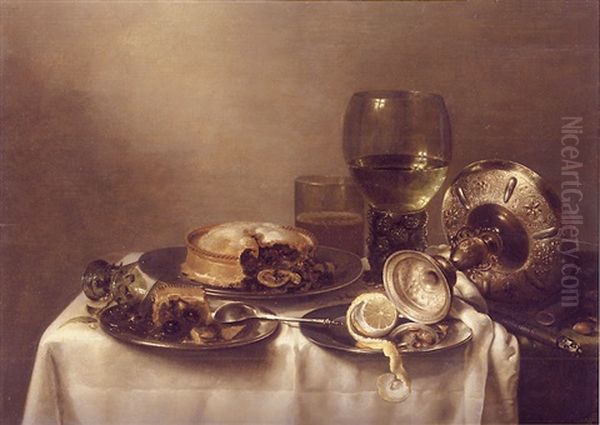 A Still Life Of An Overturned Silver Tazza, A Roemer With White Wine, A Glass Beaker With Beer, And Three Pewter Plates With A Partly Peeled Lemon And Partly Eaten Pies, All On A Table Oil Painting by Willem Claesz Heda