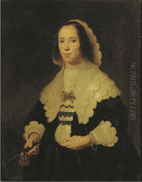 Portrait Of A Lady In A Black Dress, With Lace Cuffs And Collar, Holding A Fan In Her Left Hand Oil Painting by Bartholomeus Van Der Helst