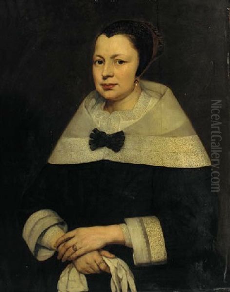 Portrait Of A Lady In Black Costume, Gloves In Her Hand Oil Painting by Bartholomeus Van Der Helst